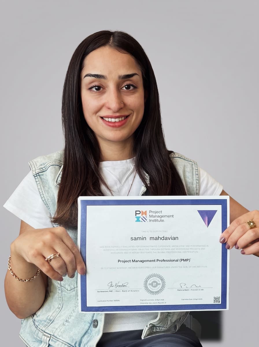 Samin Mahdavian holding a PMP certificate.
